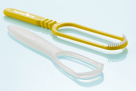 Zungenb�rste (gelb) und Zungenschaber (weiss)